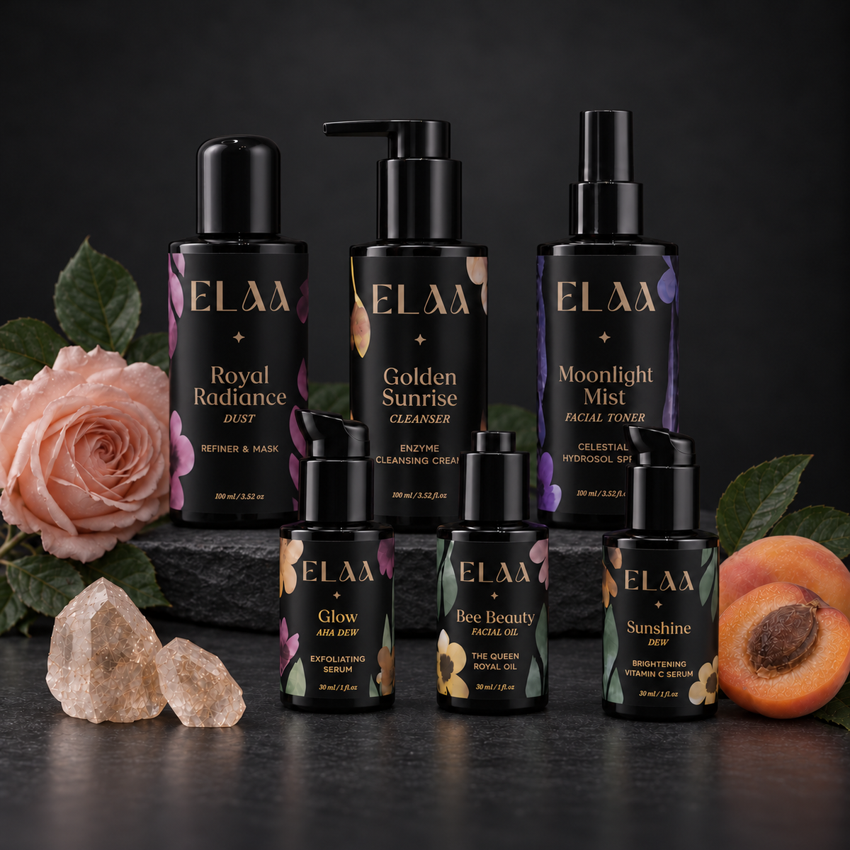 ELAA Luminous Skin collection arranged on dark slate with softly lit packaging