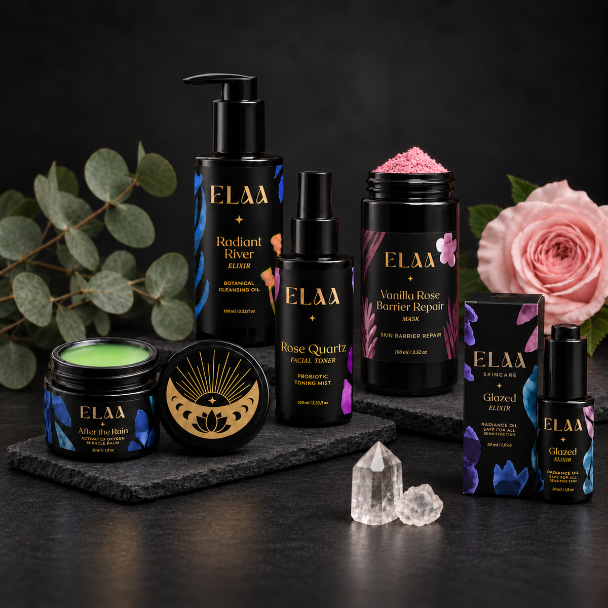 ELAA Skin Barrier Repair collection arranged on dark slate with softly lit packaging