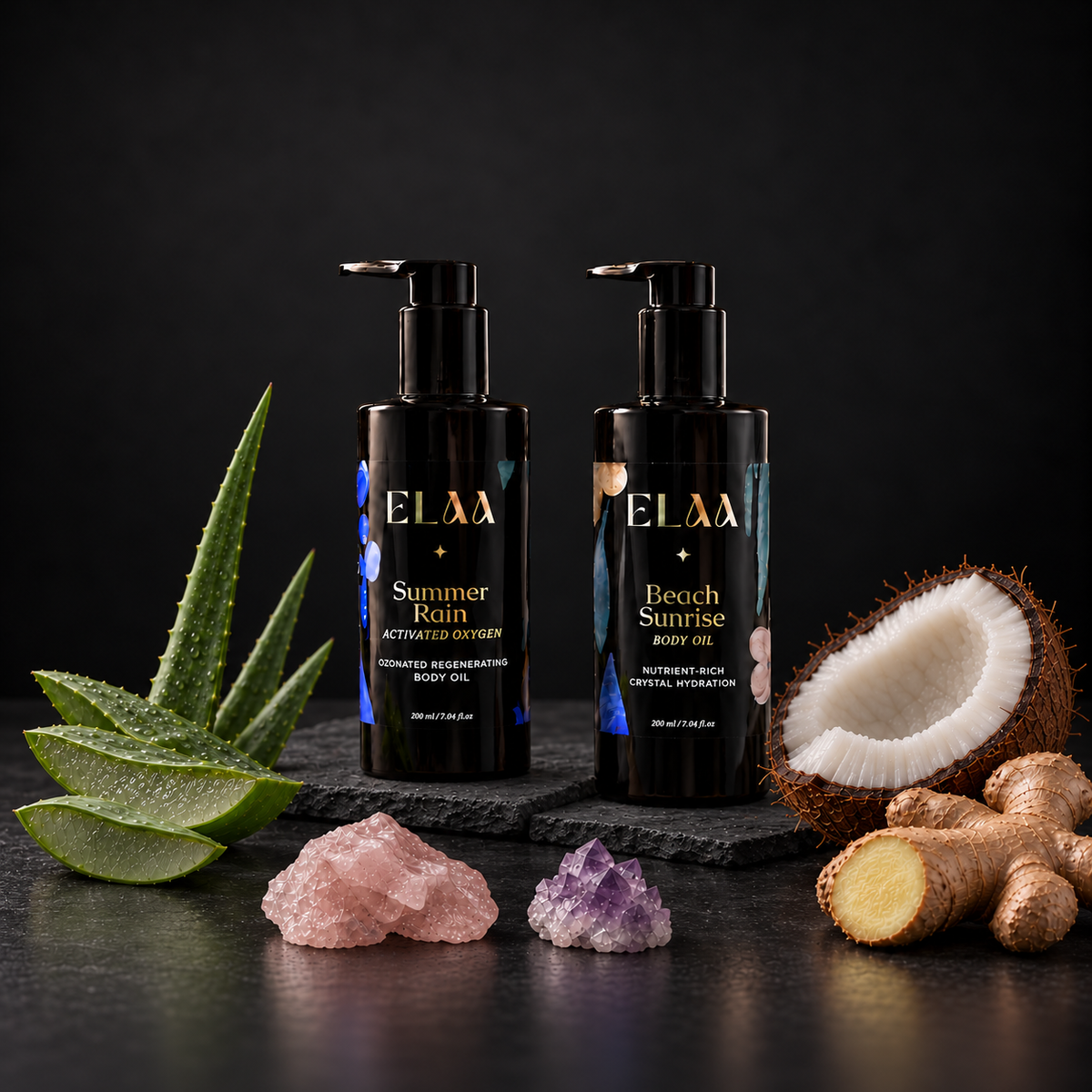 ELAA Body Oils collection arranged on dark slate with softly lit packaging