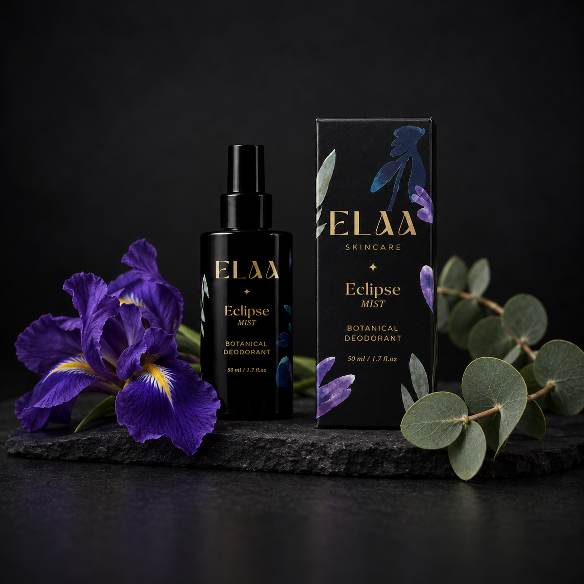 ELAA Deodorant collection arranged on dark slate with softly lit packaging