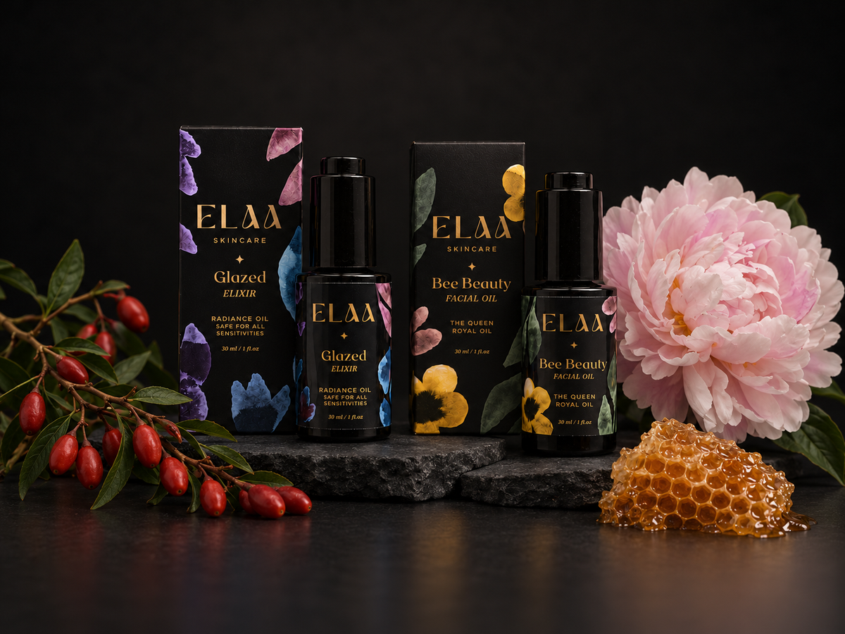 ELAA Oil Facial Moisturizers collection arranged on dark slate with softly lit packaging