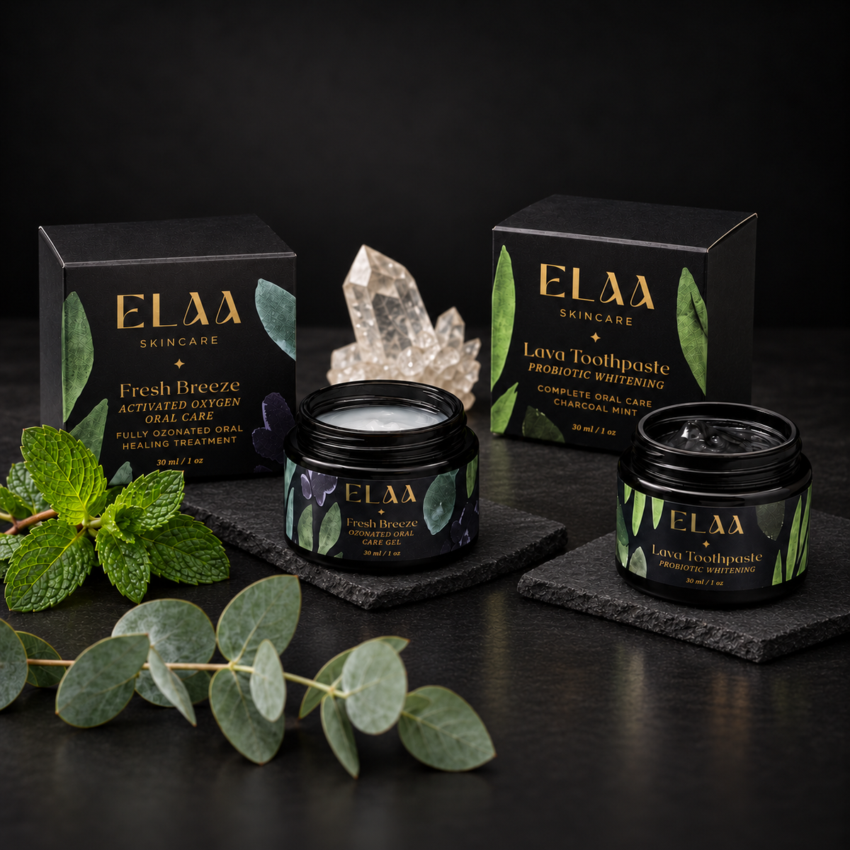 ELAA Oral Care collection arranged on dark slate with softly lit packaging