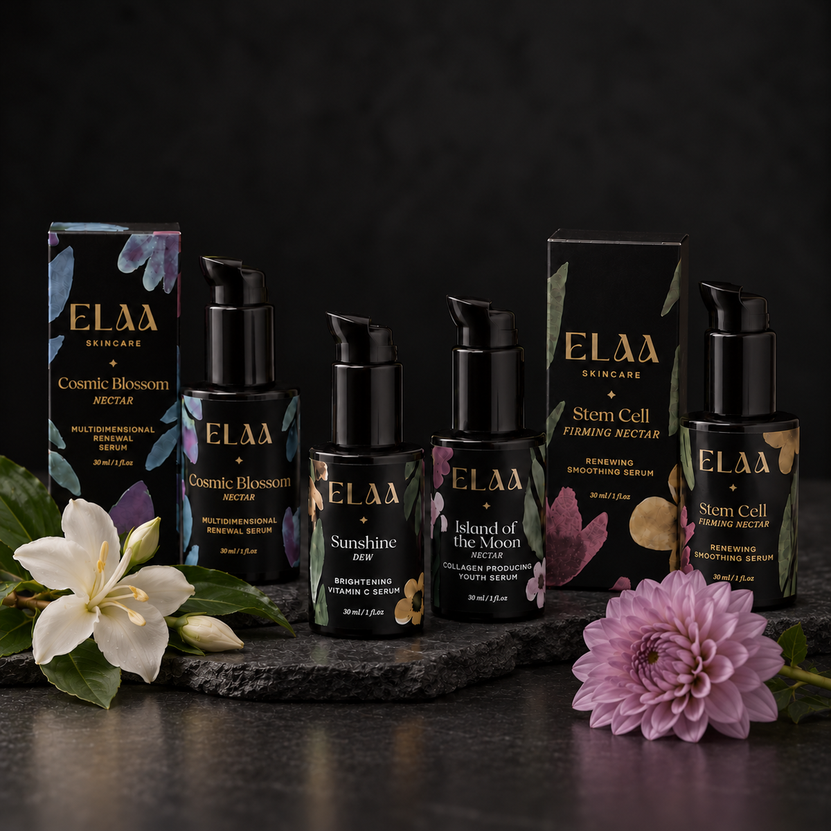 ELAA Serums collection arranged on dark slate with softly lit packaging