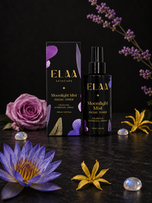 ELAA Moonlight Mist with botanicals on a flat dark surface