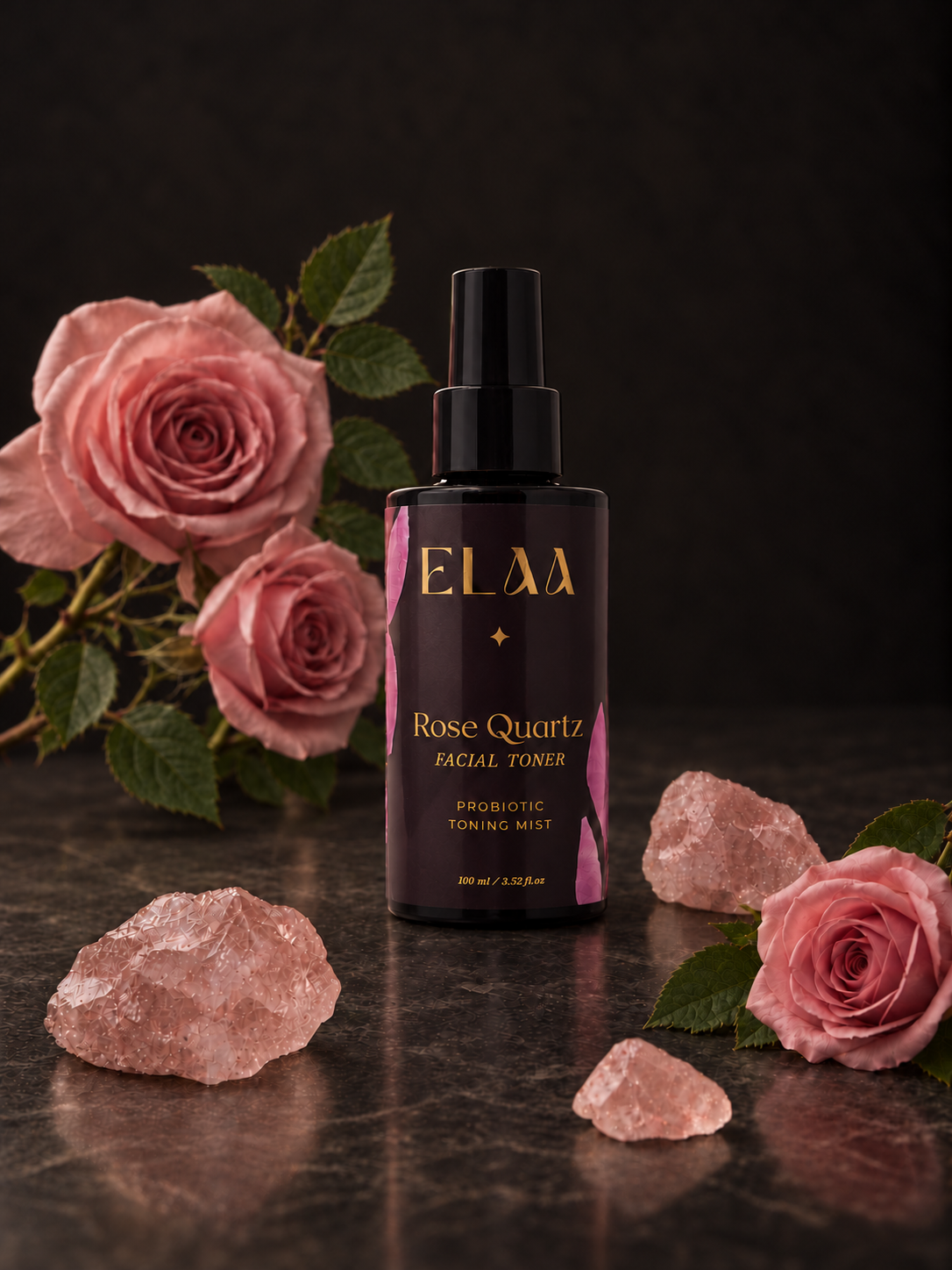 ELAA Rose Quartz Probiotic Toning Mist with pink roses and rose quartz in soft light on dark stone