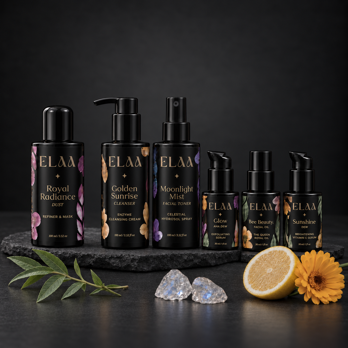 ELAA Glow Ritual product ritual arranged on dark slate with softly lit packaging
