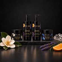 ELAA Baby Ritual product ritual arranged on dark slate with softly lit packaging