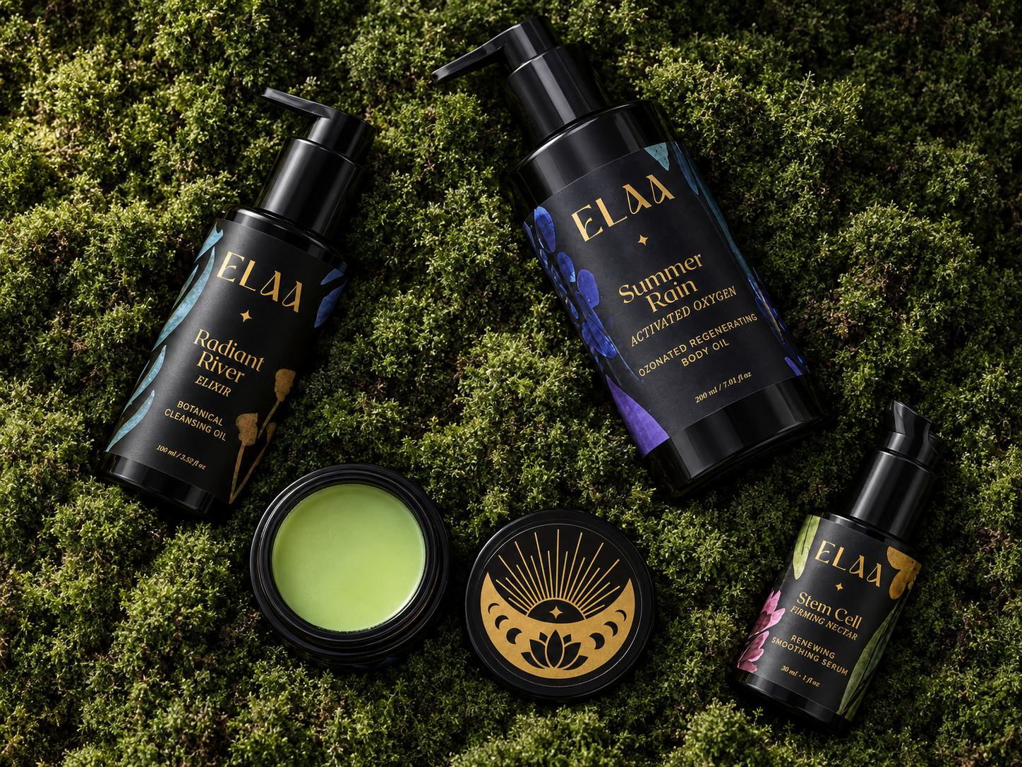 Four Elaa skincare products arranged on a bed of green moss