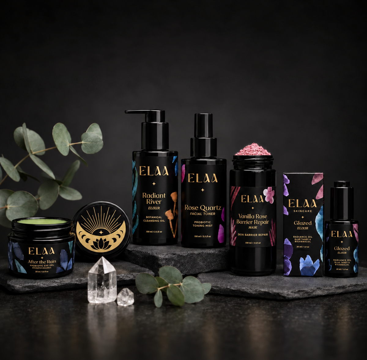 ELAA Skin Barrier Repair Ritual product ritual arranged on dark slate with softly lit packaging