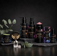 ELAA Skin Barrier Repair Ritual product ritual arranged on dark slate with softly lit packaging