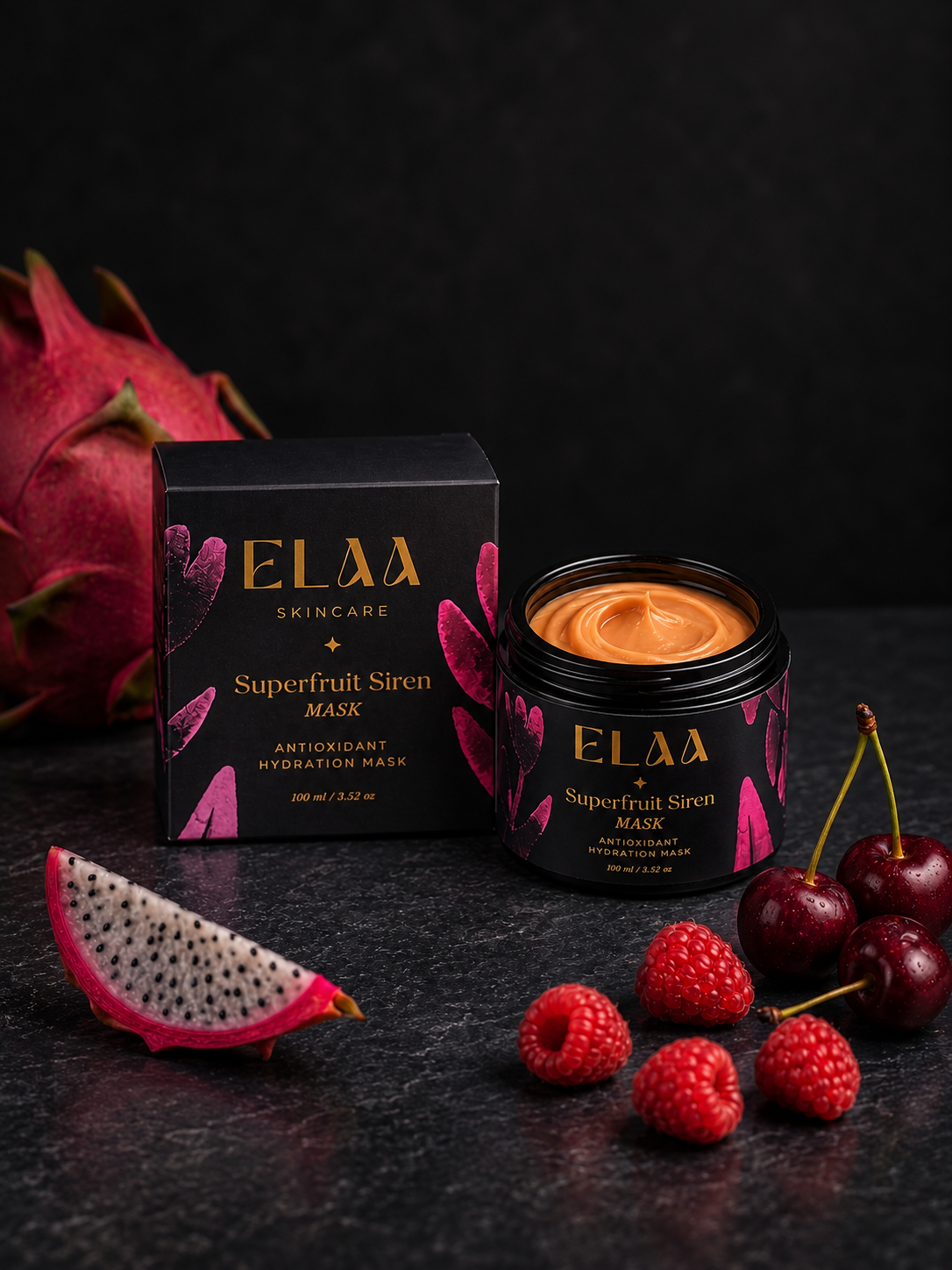 ELAA Superfruit Siren mask with orange cream, carton and fruits on a flat dark surface