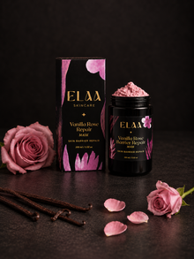 ELAA Vanilla Rose mask and carton with roses and petals on a flat dark surface